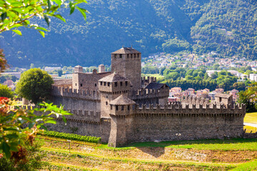 Picturesque summer view of medieval fortified Montebello Castle protecting old city of Bellinzona on foothills of Swiss Alps