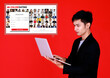 © Bangkok Click Studio - Young businessman holding laptop notebook computer searching in online dating web and start filling register form for application member. Business man looking at pfofile photos on love match website