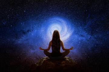 Woman with yoga pose in front of the universe