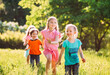 © davit85 - Large group of kids, friends boys and girls running in the park on sunny summer day in casual clothes .