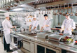 © davit85 - Modern kitchen. The chefs prepare meals in the restaurant's kitchen.