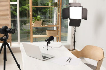 Wall Mural - Modern blogger's workplace with professional equipment and laptop in room