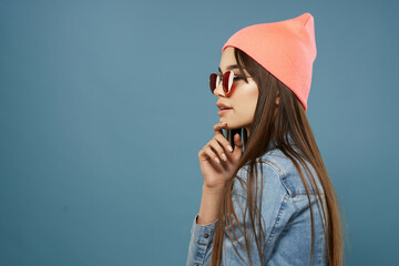 Wall Mural - pretty woman in denim jacket pink hat glasses fashion modern style