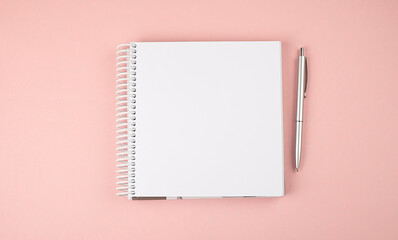 Poster - Notebook on the pink background. Copy space