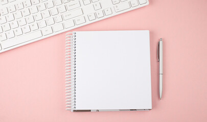 Poster - Pink pastel woman office desk with keyboard and notebook .Top view with copy space
