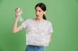 © Drobot Dean - Young brunette shocked woman posing with plastic waste