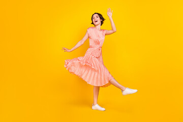 Poster - Full length body size view of lovely dreamy cheerful girl dancing having fun good mood isolated over bright yellow color background