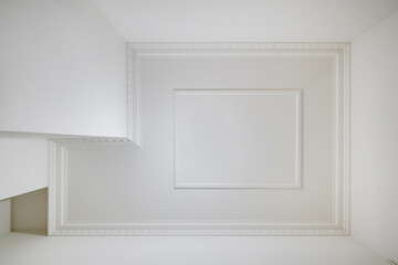 Wall Mural - corner of ceiling and walls with intricate crown moulding. Interior construction and renovation concept.