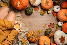 Autumn Background With Woman Sitting Between Pumpkins, Top View