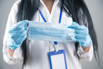 doctor holding a medical mask