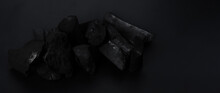 Wood Charcoal. Black Charcoal On Black Textured Floor. Used For Cooking Grill Or Other Industries. Natural Wood Charcoal. Black Carbon Reesidue Produced By Strongly Heating Wood. For Traditional BBQ