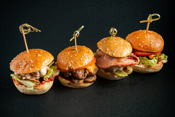 Canvas Print - mini burgers on the black background