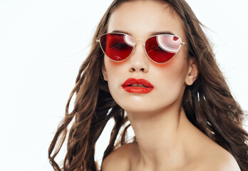 Wall Mural - attractive woman wearing sunglasses naked shoulders makeup red lips
