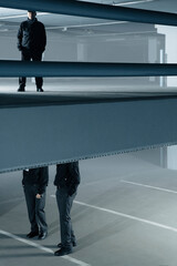 Wall Mural - Security guards standing in empty parking garage