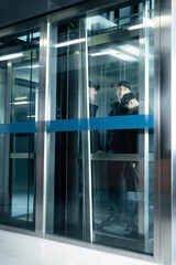 Wall Mural - Security guards standing in elevator