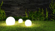 canvas print picture - Drei Leuchtkugeln leuchten abends im Garten im Gras