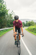 © ADDICTIVE STOCK - Bicyclist riding bike during training on countryside road