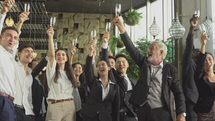 Wall Mural - Group of business people toasting champagne to celebrate on New Year. corporate team party. happy moment together