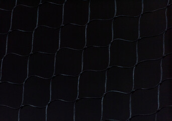 Black net on black background. Sport concept. Suitable for posters, covers, banners, and other marketing purposes.