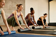 © Drazen - Happy female athletes have group training at exercise club.
