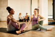 © Drazen - Happy athletic women talk while relaxing after exercising at health club.