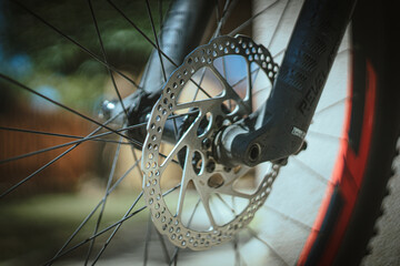 Sticker - Closeup shot of bicycle's spinning wheel with blurred background