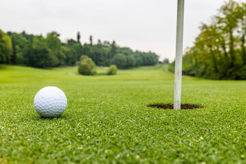 Canvas Print - Golf ball in the court on a sunny day