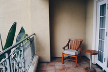 Wooden Chair And Small Table On A Balcony