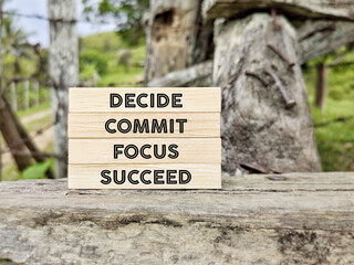 Wall Mural - Inspirational and motivational concept - decide commit focus succeed text background.