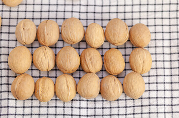 Aufkleber - A lot of whole walnuts on a napkin close-up. Healthy, organic and healthy food with a high content of protein and protein.