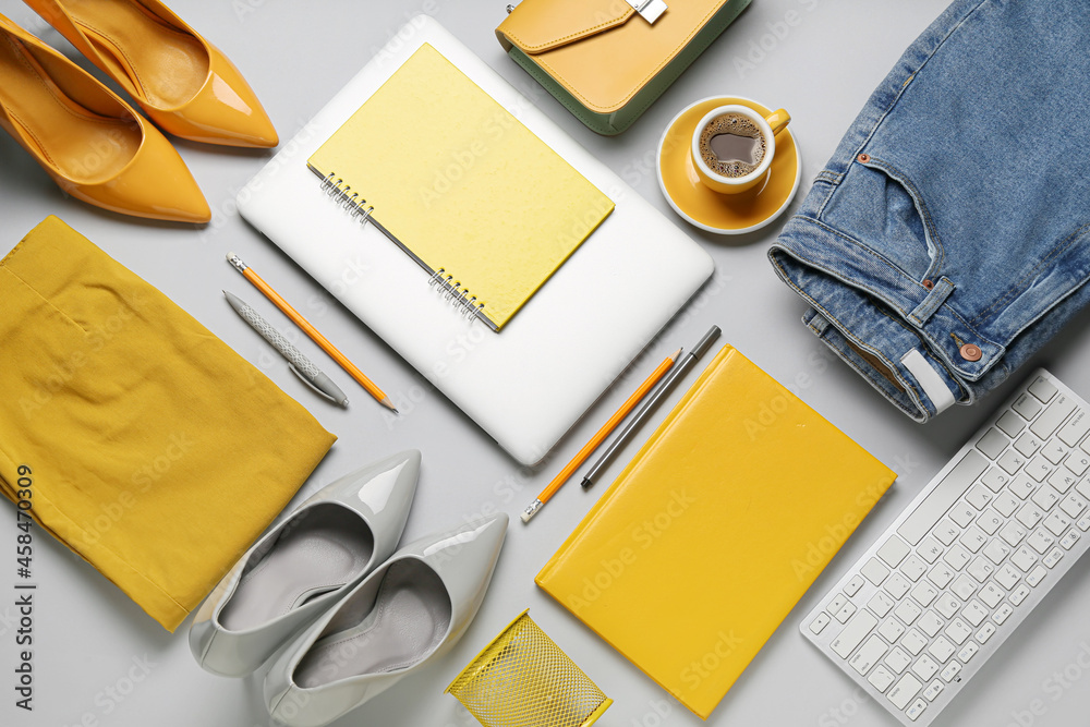 Female clothes, accessories and modern gadgets on light background, closeup