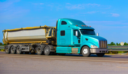 Canvas Print - dump truck semi-trailer moving on country road