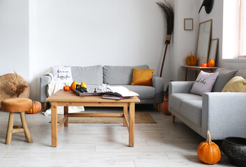 Interior of stylish living room decorated for Halloween