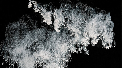 Wall Mural - White cloud of ink on a black background. White watercolor paints in water. White watercolor ink in water on a black background. Meditative magic abstract background.