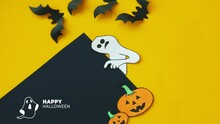 Halloween Background. Animated Image Of A Disappearing Ghost. The Ghost Points To A Place For Text, Silhouettes Of Bats, Pumpkins. 4K