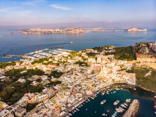 Wall Mural - Aerial drone view of Italian island Procida. Marina Corricella and fort