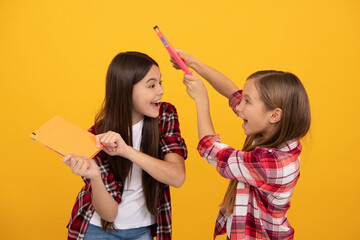 Poster - cheerful children in casual checkered shirt having fun with notebooks, best friend