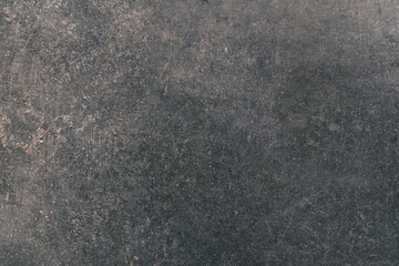 Black or dark gray rough grainy stone texture background