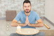 © auremar - tranquil man in prayer pose by lit candles