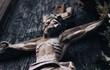 Fragment of wood statue of crucifixion of Jesus Сhrist. Horizontal image.