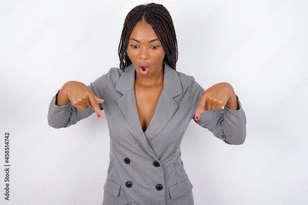 Finger Getting Zapped Amazed dMODEL points down with fore fingers, opens mouth being shocked ...