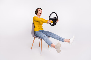 Wall Mural - Full size photo of impressed brunette young lady drive wear shirt jeans isolated on grey color background