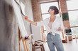 © deagreez - Photo portrait young girl wearing white shirt keeping brush creating painting on canvas spending free time alone