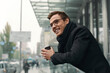 © Drobot Dean - Young european businessman looking on modern city