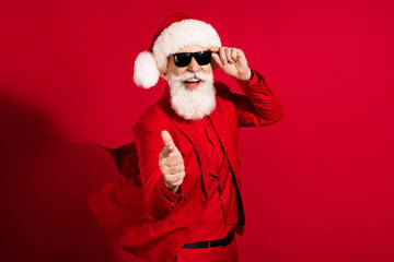 Poster - Portrait of elderly pensioner retired bearded cheery grey-haired man dancing pointing at you festival isolated over bright red color background