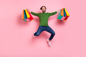 Sticker - Full body photo of excited satisfied person arms hold boutique bags open mouth isolated on pink color background