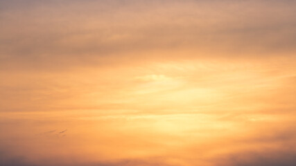 Wall Mural - Wonderful view of cumulus clouds sky with orange sun light at sunset of summer