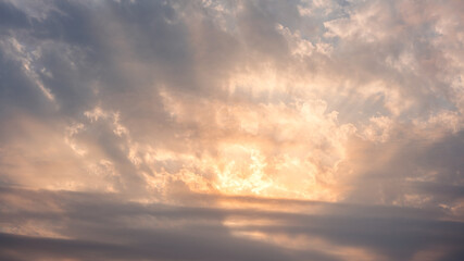 Wall Mural - Wonderful view of cumulus clouds sky with orange sun light at sunset of summer