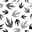 Dinosaur footprints seamless pattern. Vector black and white doodle illustration
