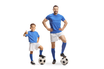 Football coach and a boy with a soccer ball gesturing thumbs up